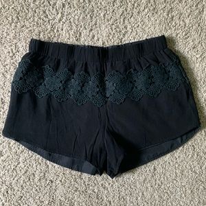 Black embroidered shorts with elastic waist